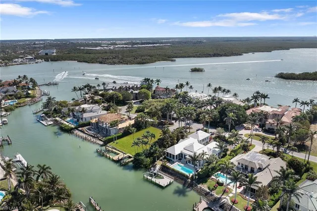 an aerial view of a houses with ocean view