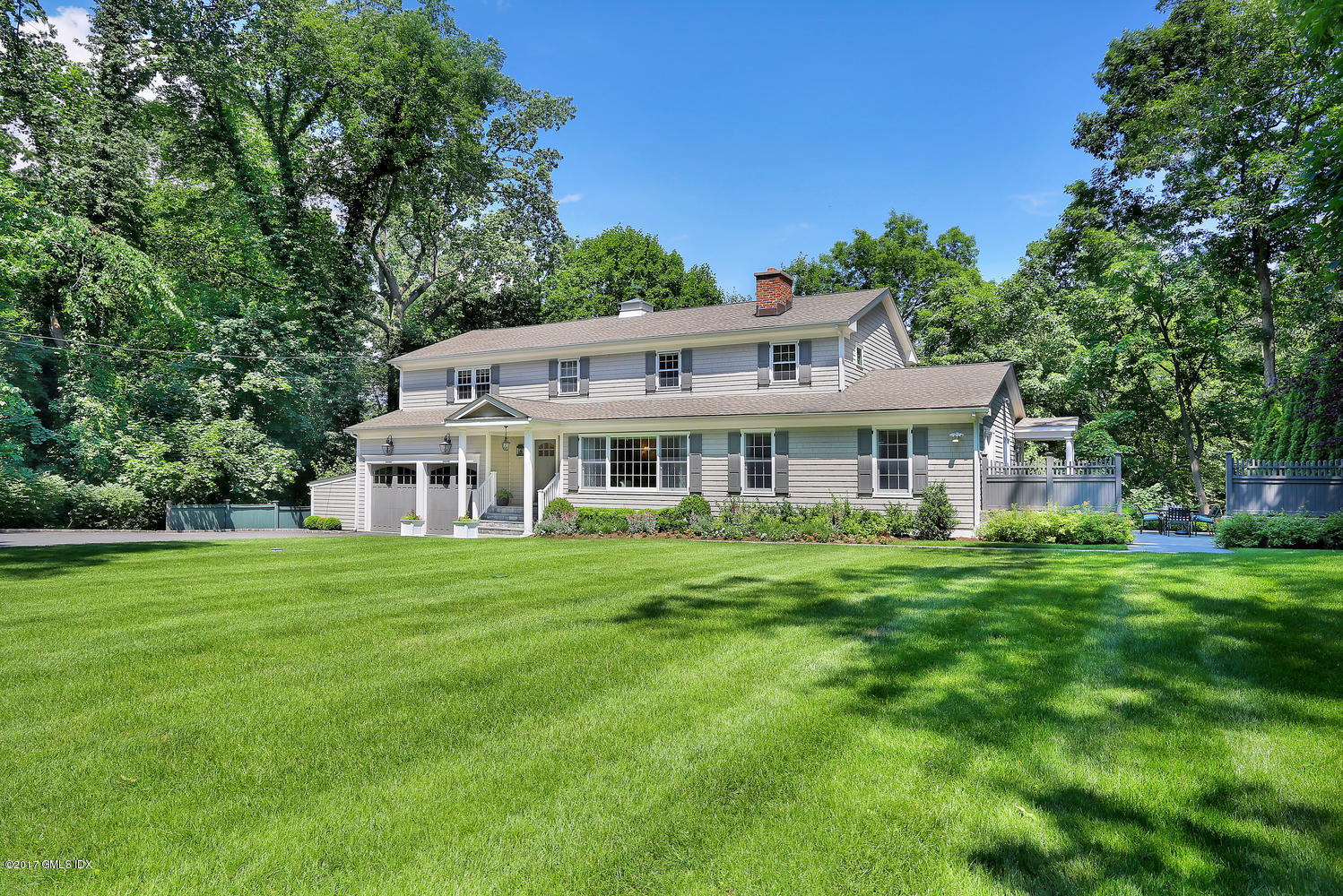 a front of a house with a garden
