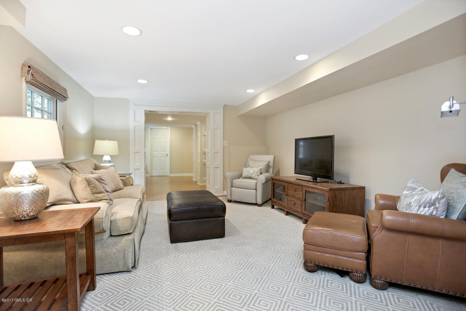111 Stanwich Road Greenwich, CT 06830 - Photo 17 of 24 a living room with furniture and a flat screen tv