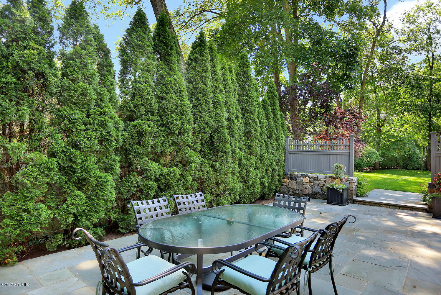 111 Stanwich Road Greenwich, CT 06830 - Photo 18 of 24 a backyard of a house with outdoor seating