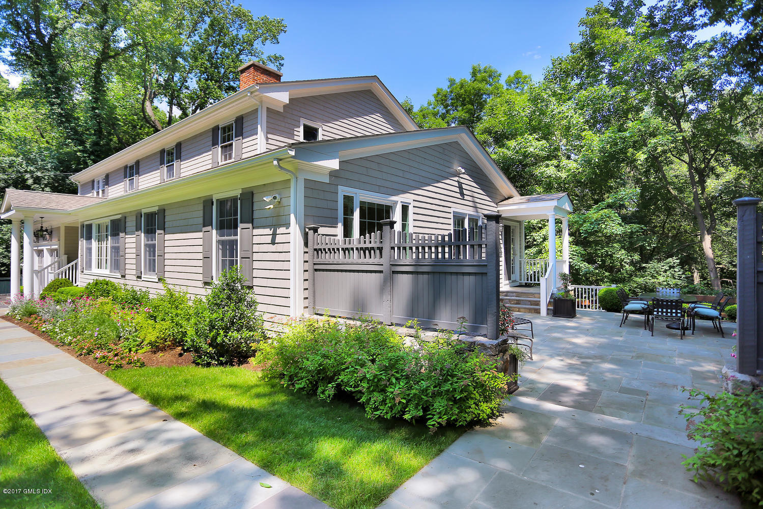 111 Stanwich Road Greenwich, CT 06830 - Photo 20 of 24 a front view of house with yard and green space