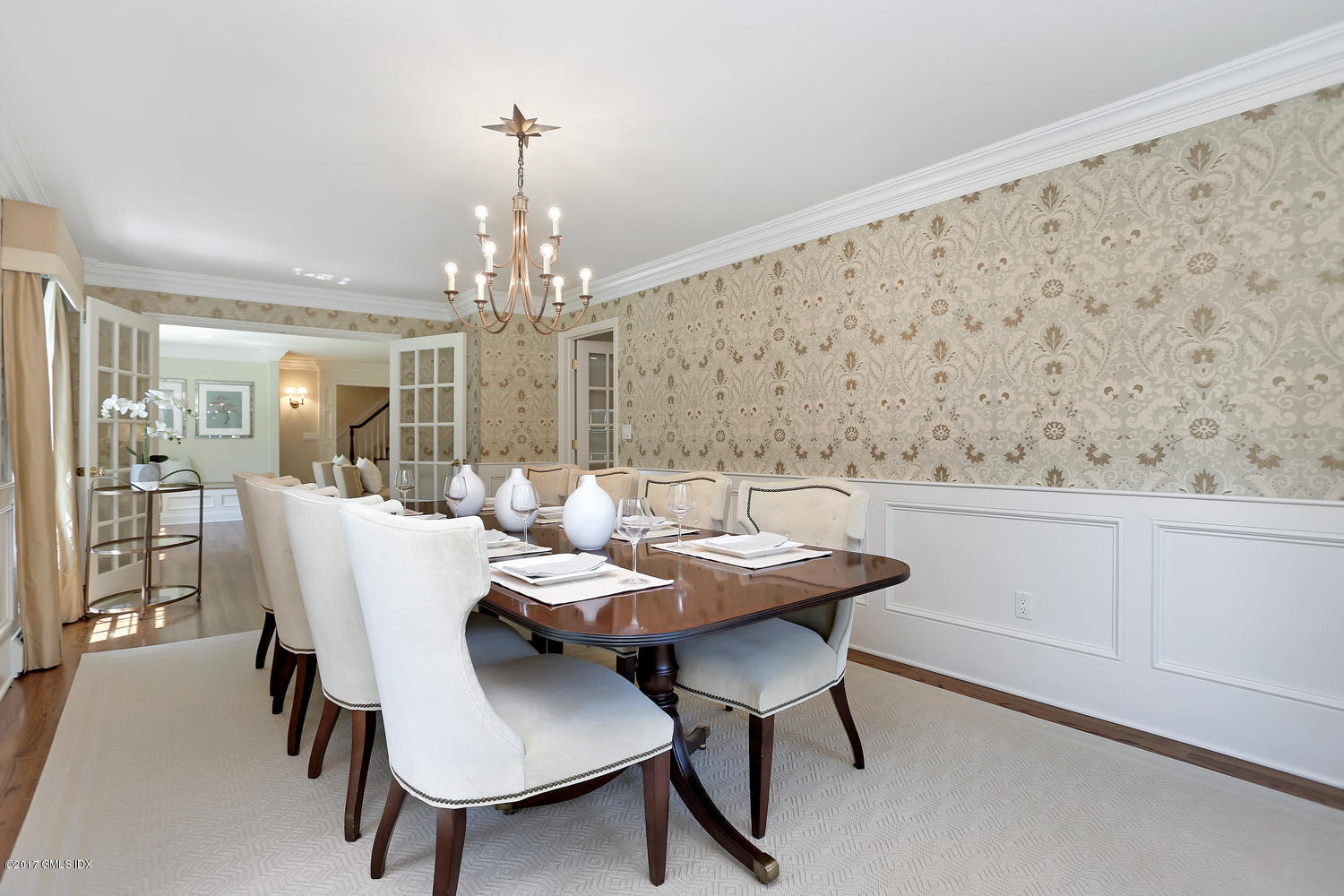 111 Stanwich Road Greenwich, CT 06830 - Photo 6 of 24 a view of a dining room with furniture and chandelier