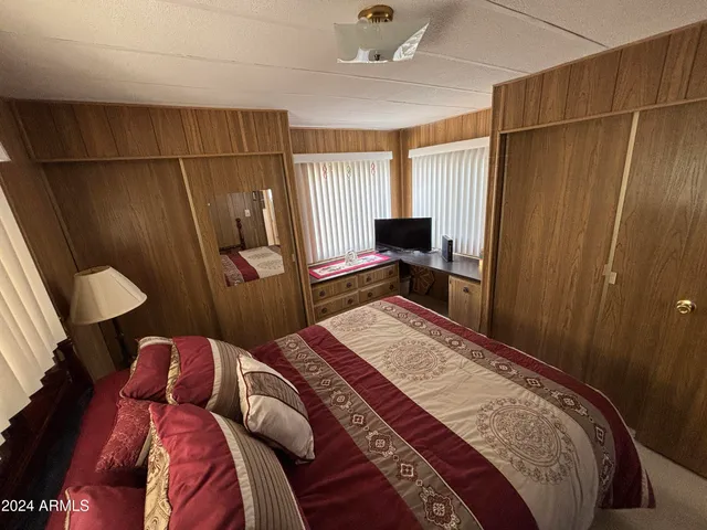 a room with a window and a flat screen tv