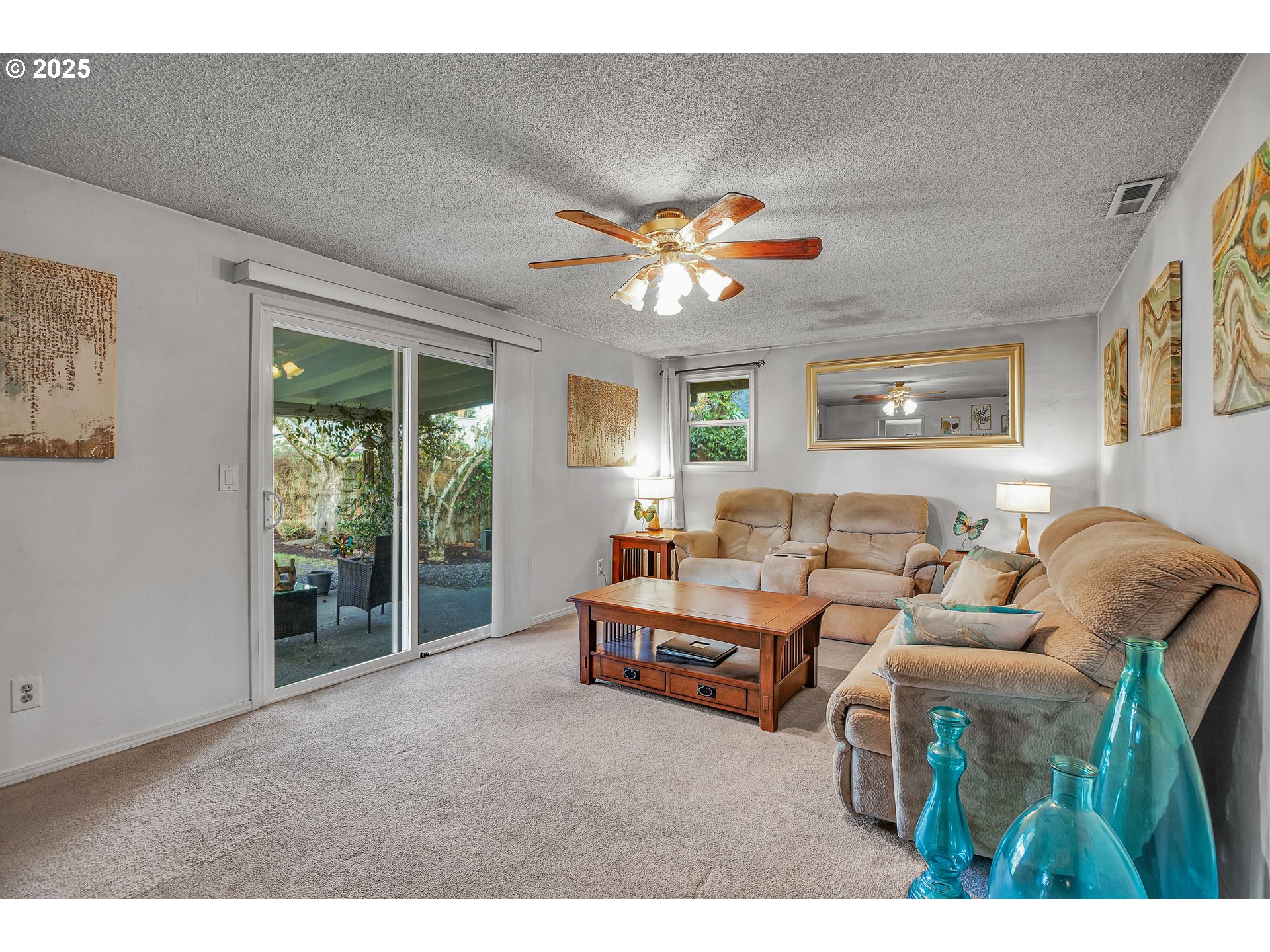 17277 Southwest Sugar Plum Court Beaverton, OR 97007 - Photo 13 of 31 a living room with furniture a chandelier and a large window