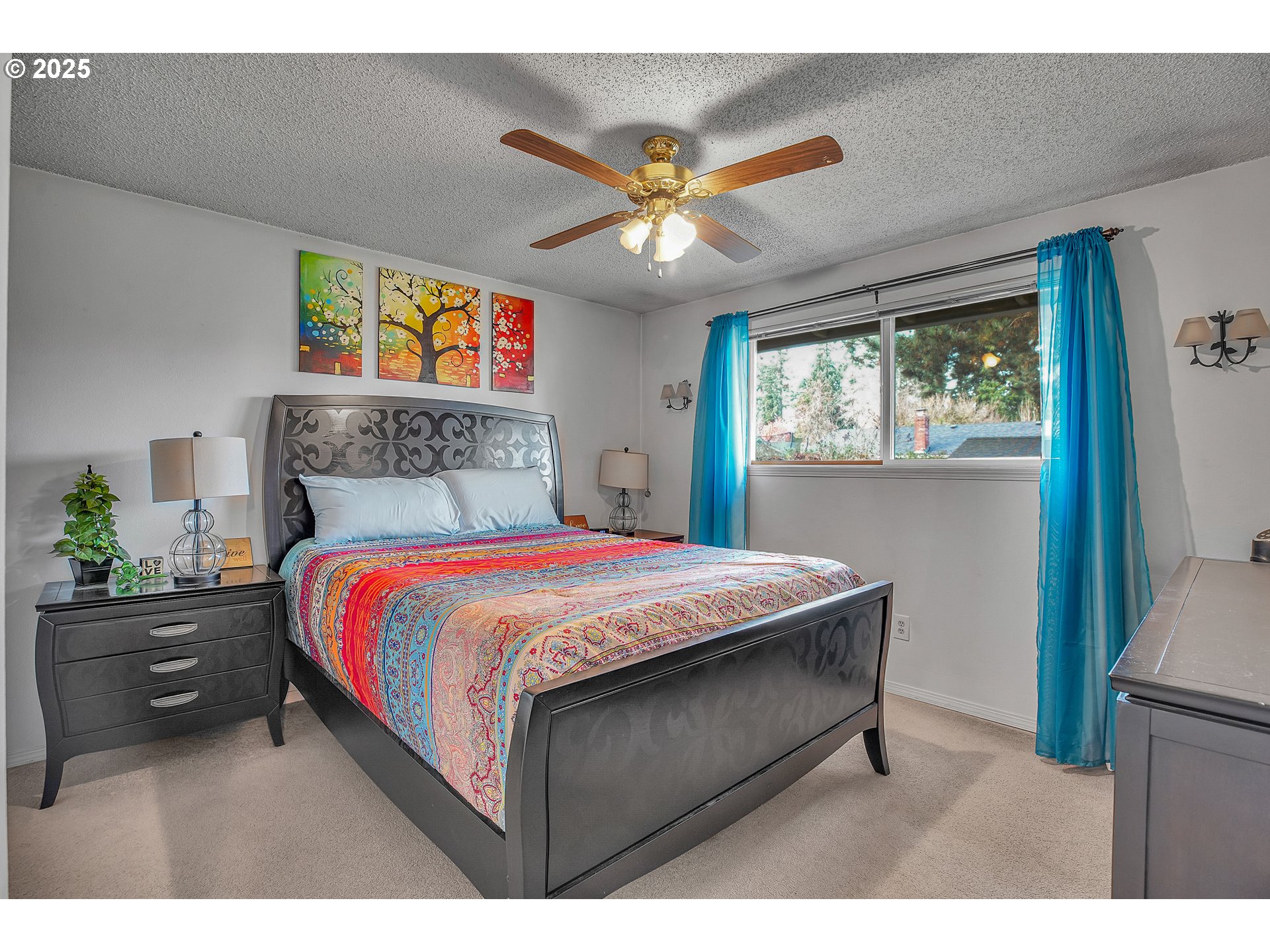 17277 Southwest Sugar Plum Court Beaverton, OR 97007 - Photo 15 of 31 a bedroom with a bed and a chandelier