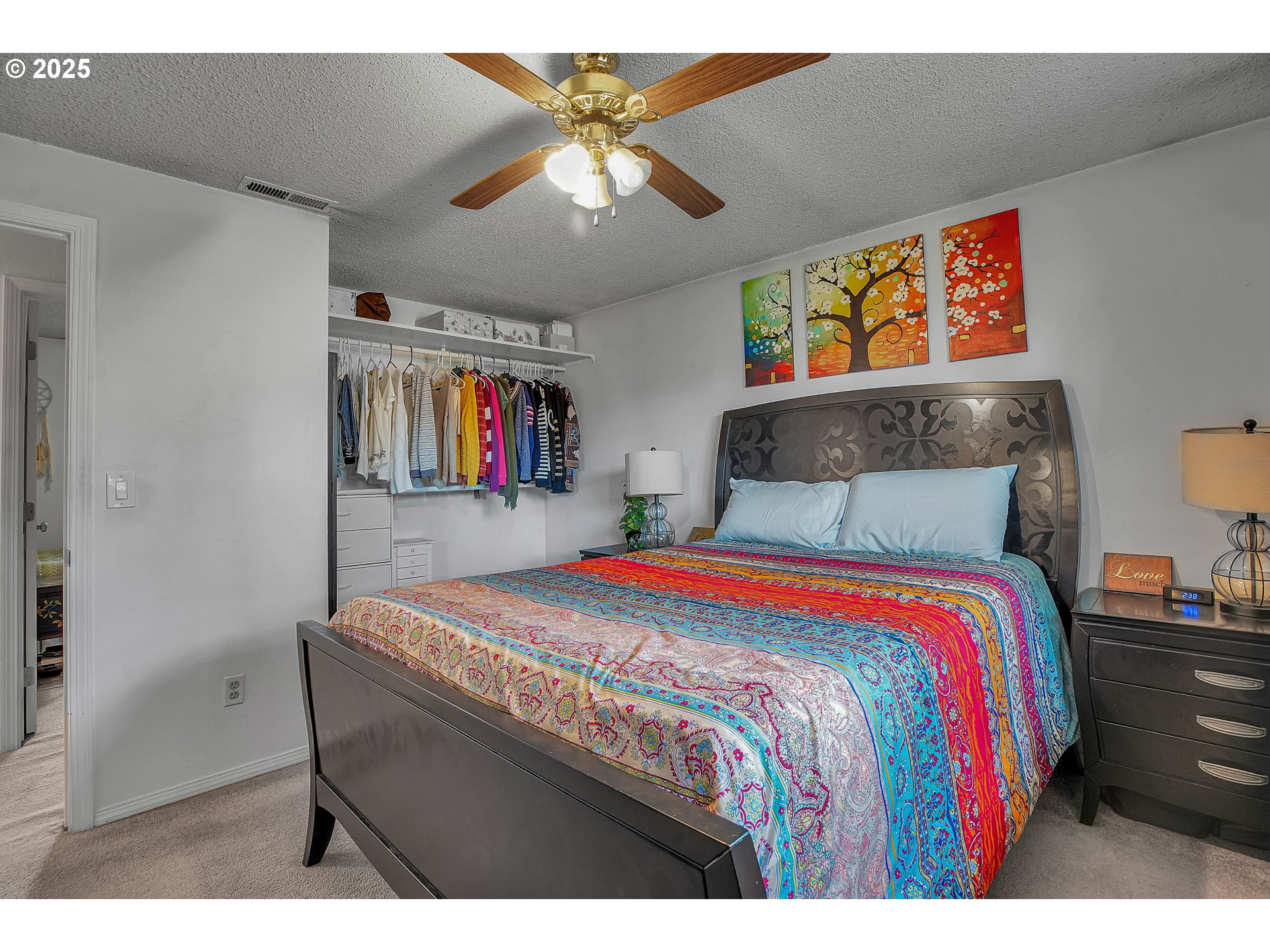 17277 Southwest Sugar Plum Court Beaverton, OR 97007 - Photo 16 of 31 a bedroom with a bed and a chandelier