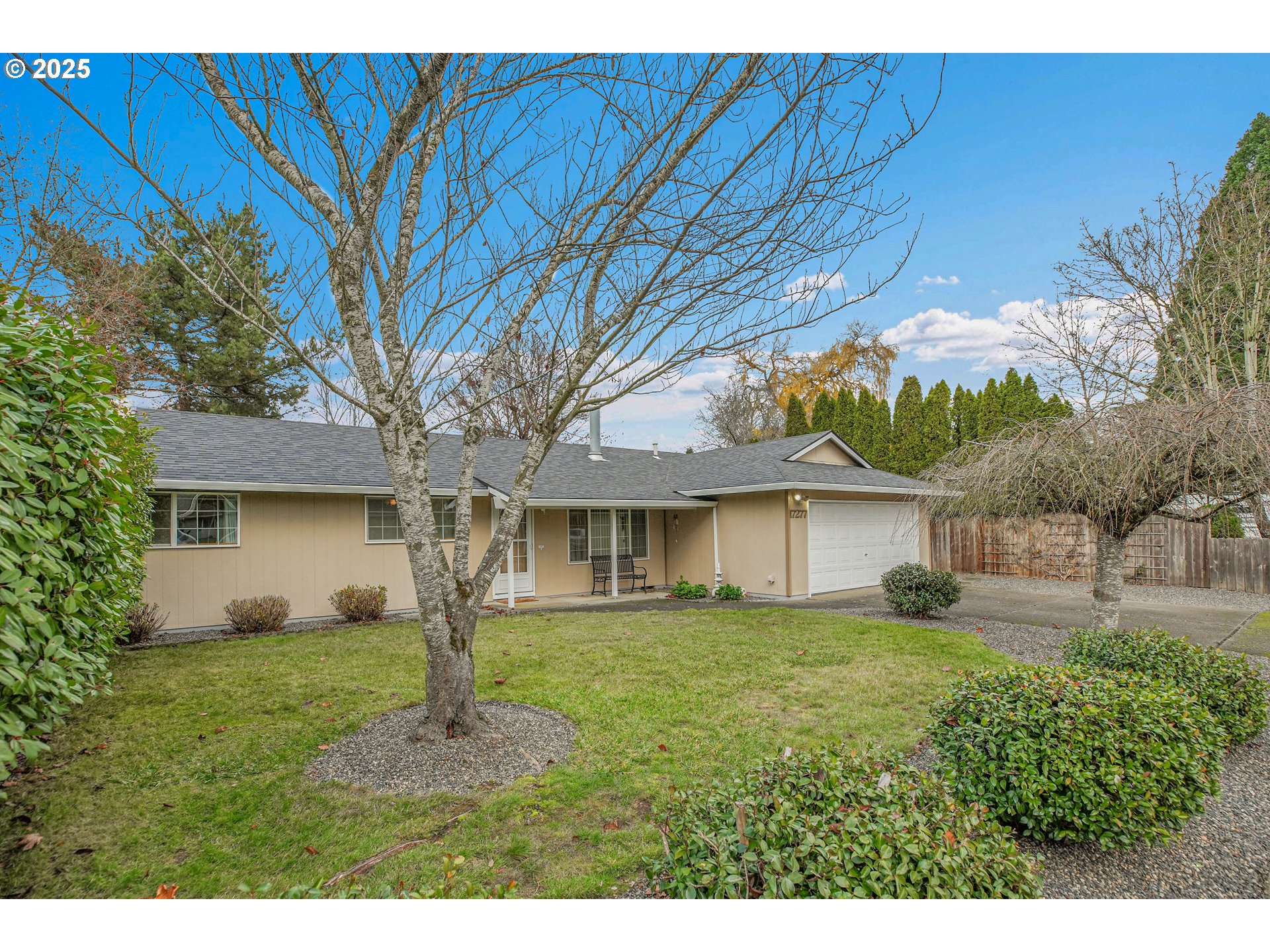 17277 Southwest Sugar Plum Court Beaverton, OR 97007 - Photo 2 of 31 a front view of a house with a yard and garage