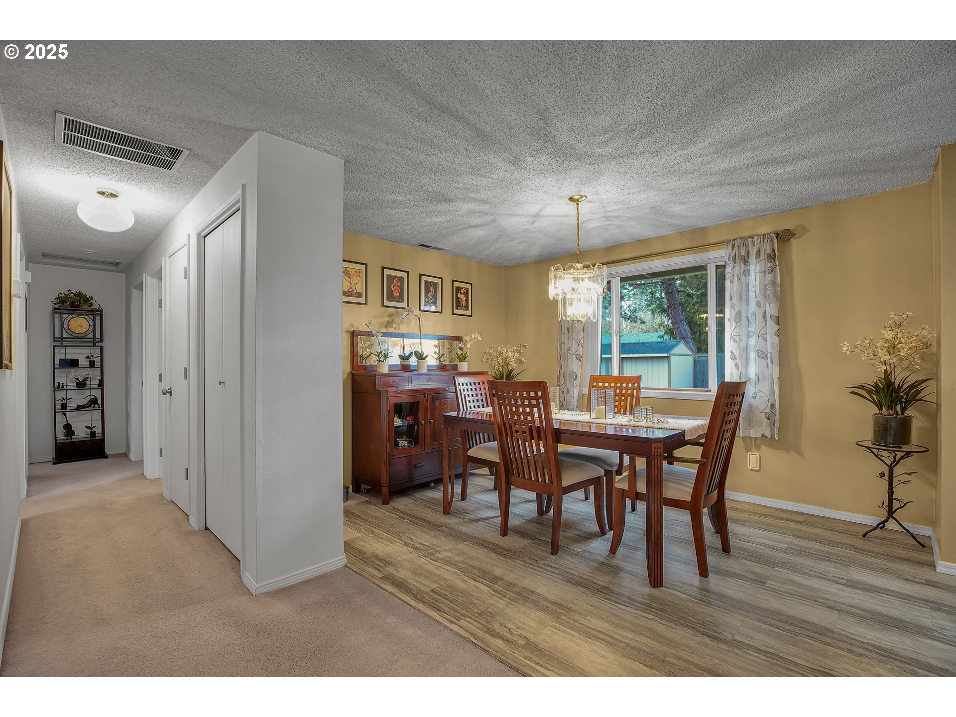 17277 Southwest Sugar Plum Court Beaverton, OR 97007 - Photo 7 of 31 a view of a dining room with furniture and wooden floor