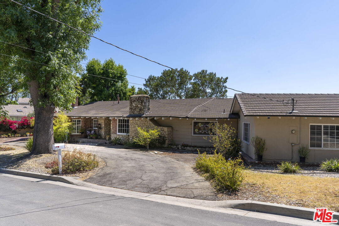 24962 Eldorado Meadow Road Hidden Hills, CA 91302 - Photo 15 of 19 front view of a house with a patio