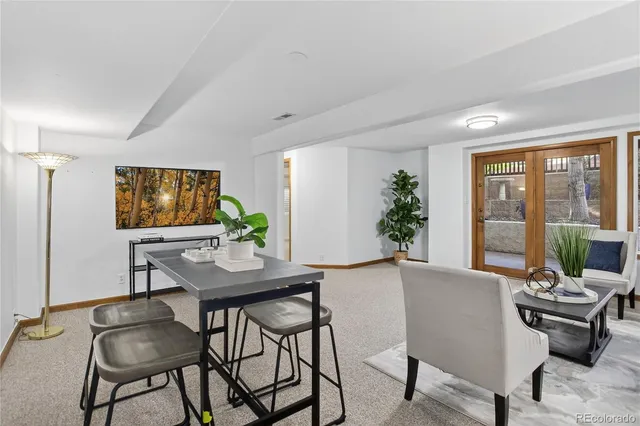 a view of a dining room with furniture window and outside view
