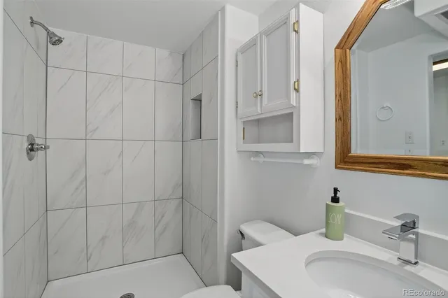 a bathroom with a sink and vanity