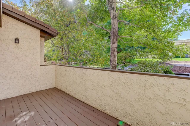 a view of a backyard from a balcony