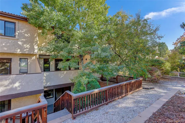 a view of house with deck and outdoor seating