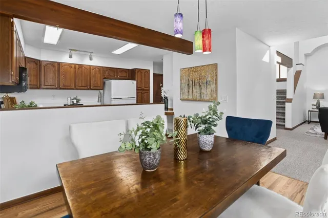 a kitchen with a table and chairs