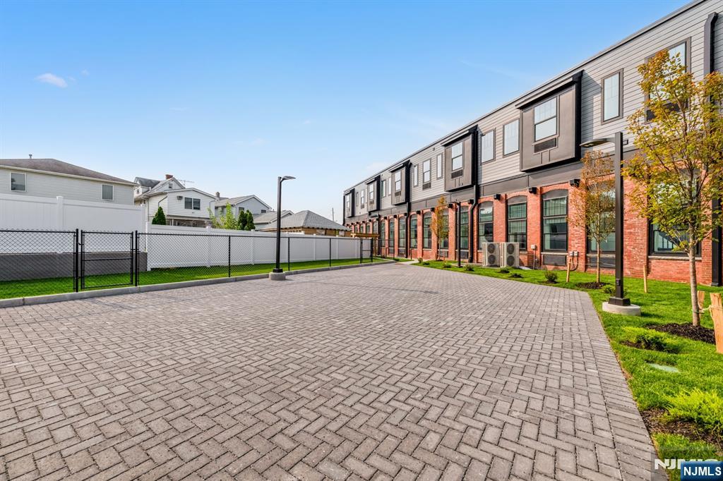315 Railroad Avenue, Unit 107 East Rutherford, NJ 07073 - Photo 20 of 25 a view of a house with a yard