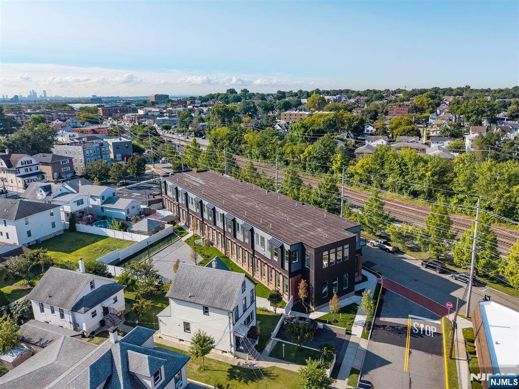 315 Railroad Avenue, Unit 107 East Rutherford, NJ 07073 - Photo 23 of 25 an aerial view of residential houses with outdoor space and swimming pool
