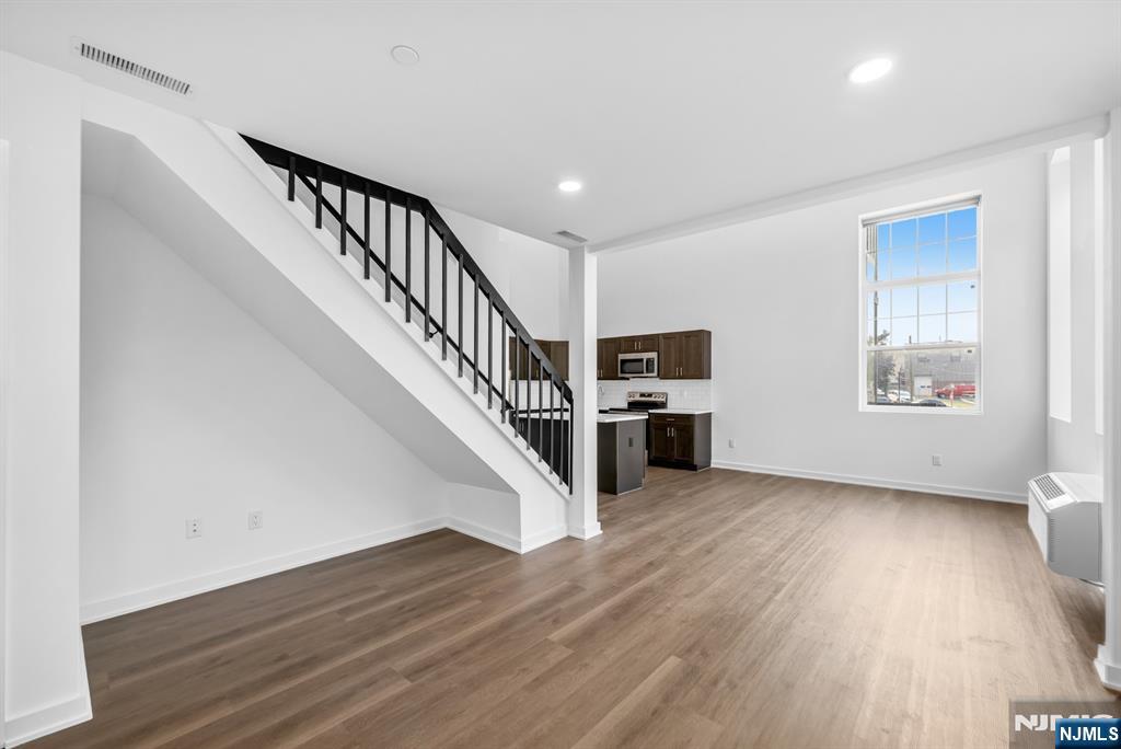 315 Railroad Avenue, Unit 107 East Rutherford, NJ 07073 - Photo 7 of 25 a view of entryway and hall with wooden floor