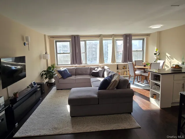 a living room with furniture and a window