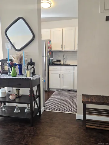 a view of kitchen with cabinets and wooden floor