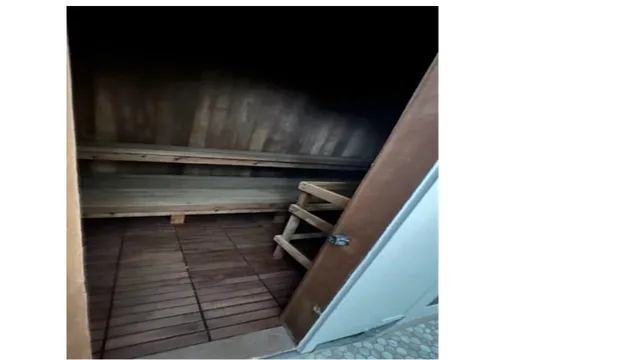 a view of a patio with a table chairs and a fire pit