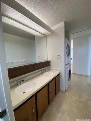 a white toilet sitting next to a bath tub