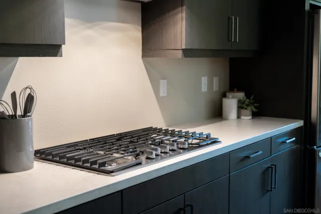 a close view of a stove a microwave and cabinets in the kitchen