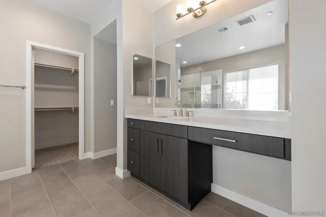 a spacious bathroom with a bathtub and a shower