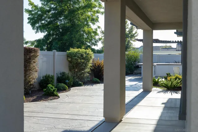 a view of a house with a flower garden