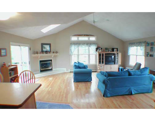11 Old Town Road Beverly, MA 01915 - Photo 3 of 8 a living room with furniture and a fireplace