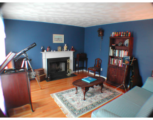 11 Old Town Road Beverly, MA 01915 - Photo 6 of 8 a living room with furniture a piano and a fireplace