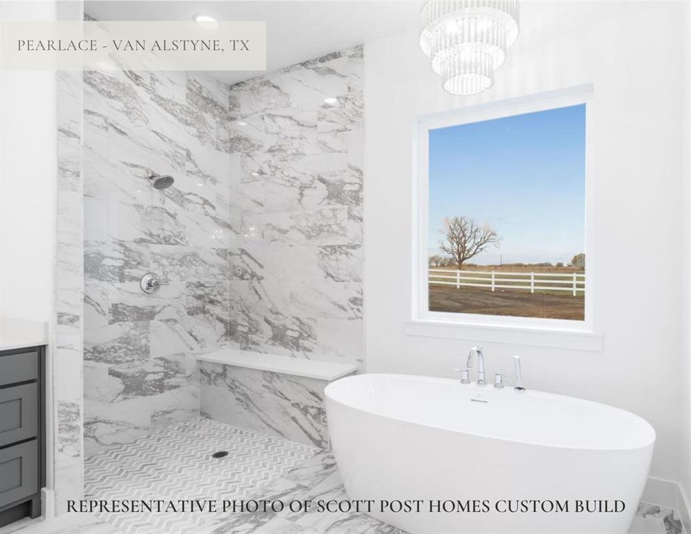 1387 McConnell Road Gunter, TX 75058 - Photo 7 of 15 Freestanding soaking tub with chrome fixtures, large window with expansive outdoor scenery, walk-in shower with marble-finish tile surround, integrated shower bench, and patterned floor tile