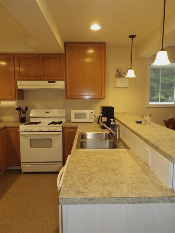 19 Wards Road Otis, ME 04605 - Photo 7 of 30 Kitchen has breakfast bar, double...