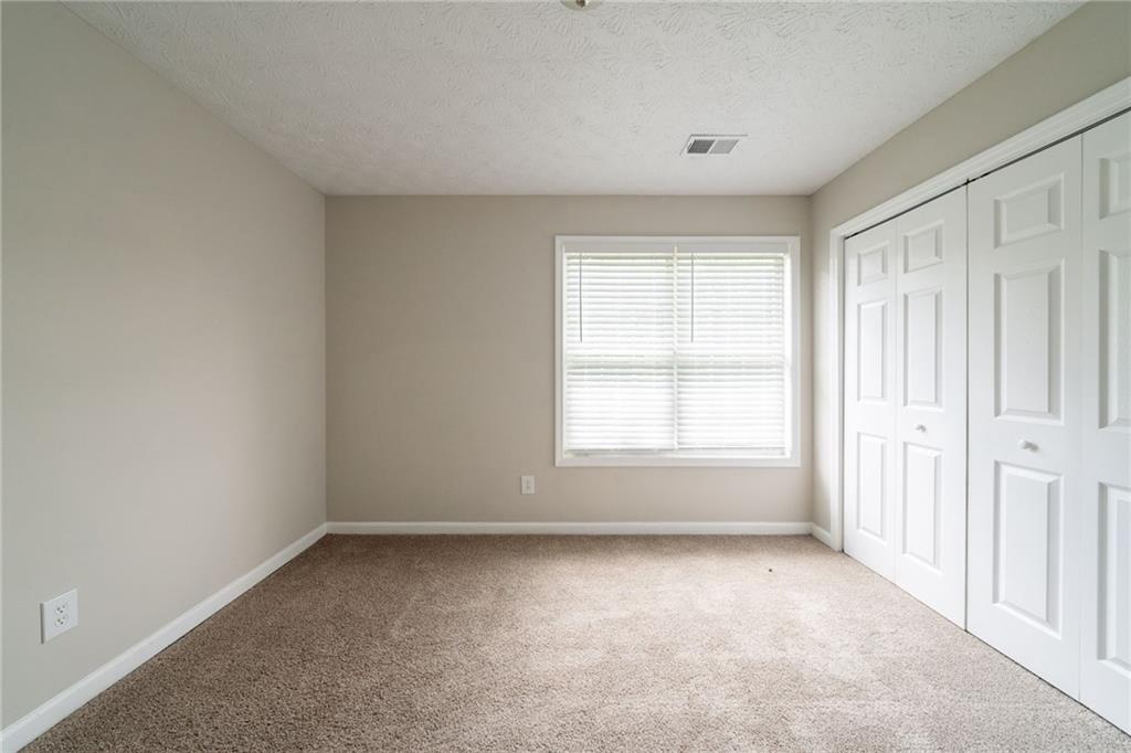 40 Princeton Court Covington, GA 30016 - Photo 21 of 31 an empty room with a window