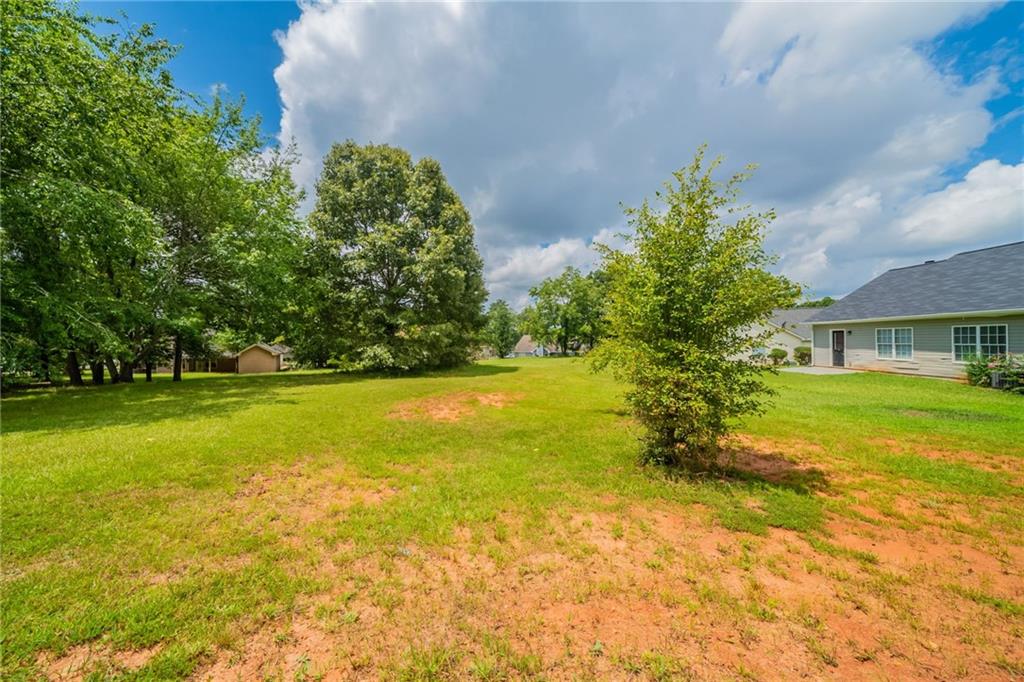 40 Princeton Court Covington, GA 30016 - Photo 28 of 31 a view of yard with swimming pool and green space