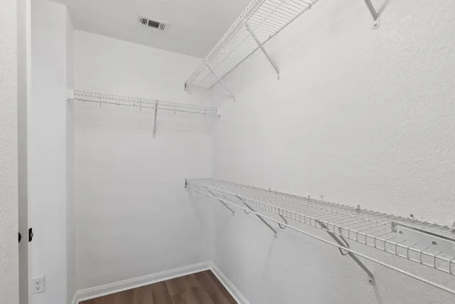 a view of a room with racks on the wall