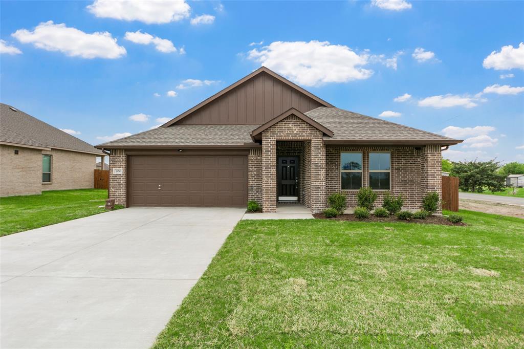 200 Pennington Road Josephine, TX 75173 - Photo 1 of 22 Single-story residence featuring a brick facade with brown siding accents
