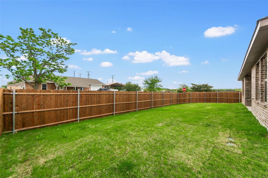 200 Pennington Road Josephine, TX 75173 - Photo 21 of 22 Expansive grassy yard with a complete wood privacy fence