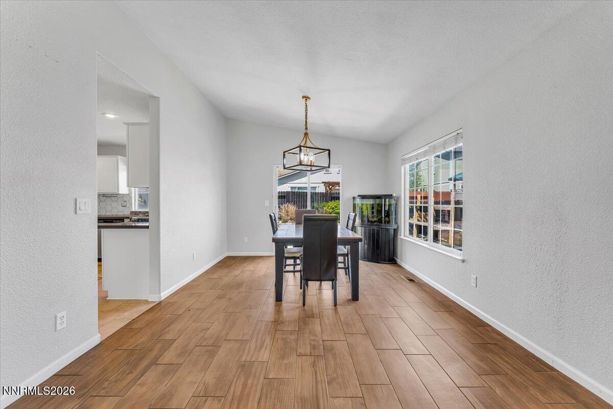 17725 Gingko Court Reno, NV 89508 - Photo 11 of 37 a view of a room with furniture window and wooden floor