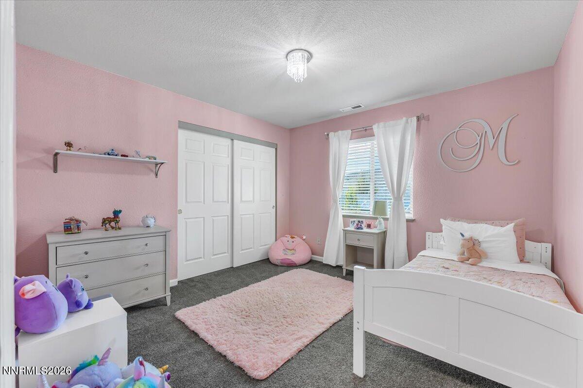17725 Gingko Court Reno, NV 89508 - Photo 23 of 37 a bedroom with a bed and window