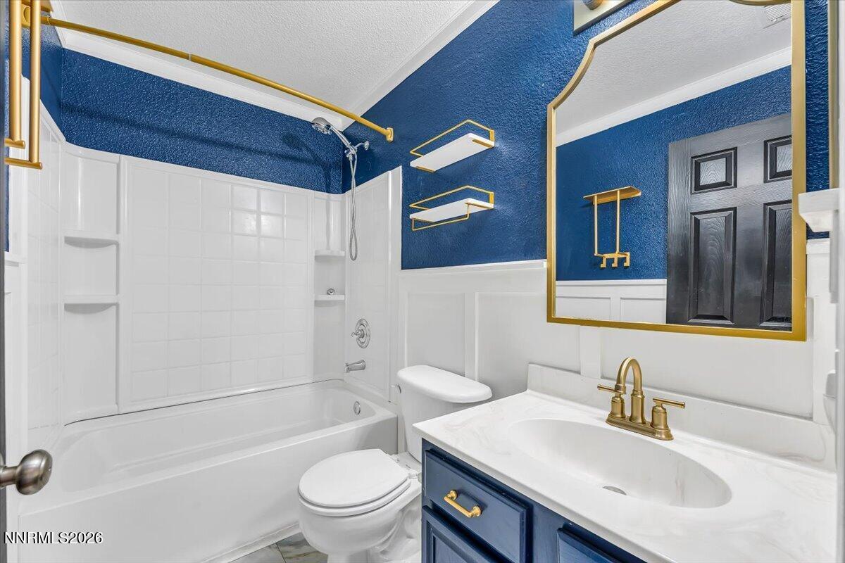 17725 Gingko Court Reno, NV 89508 - Photo 27 of 37 a bathroom with a sink toilet and shower