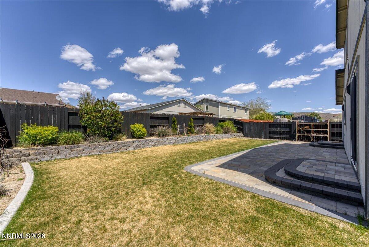 17725 Gingko Court Reno, NV 89508 - Photo 32 of 37 a view of a swimming pool with an outdoor seating and a yard