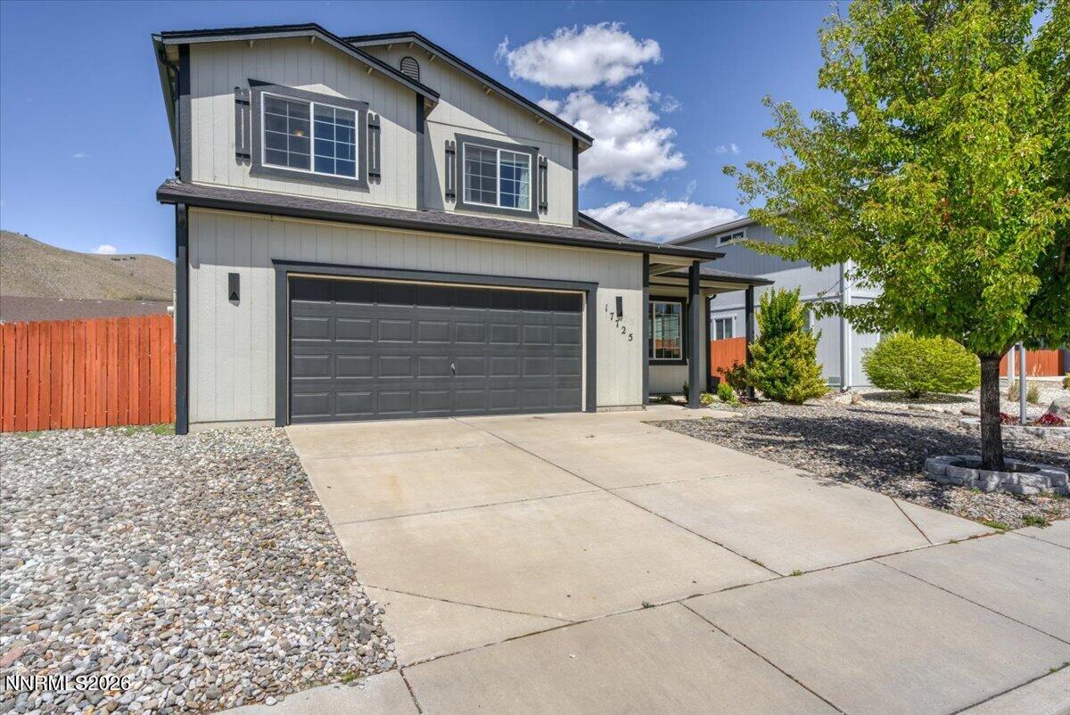 17725 Gingko Court Reno, NV 89508 - Photo 33 of 37 a front view of a house with a yard and garage