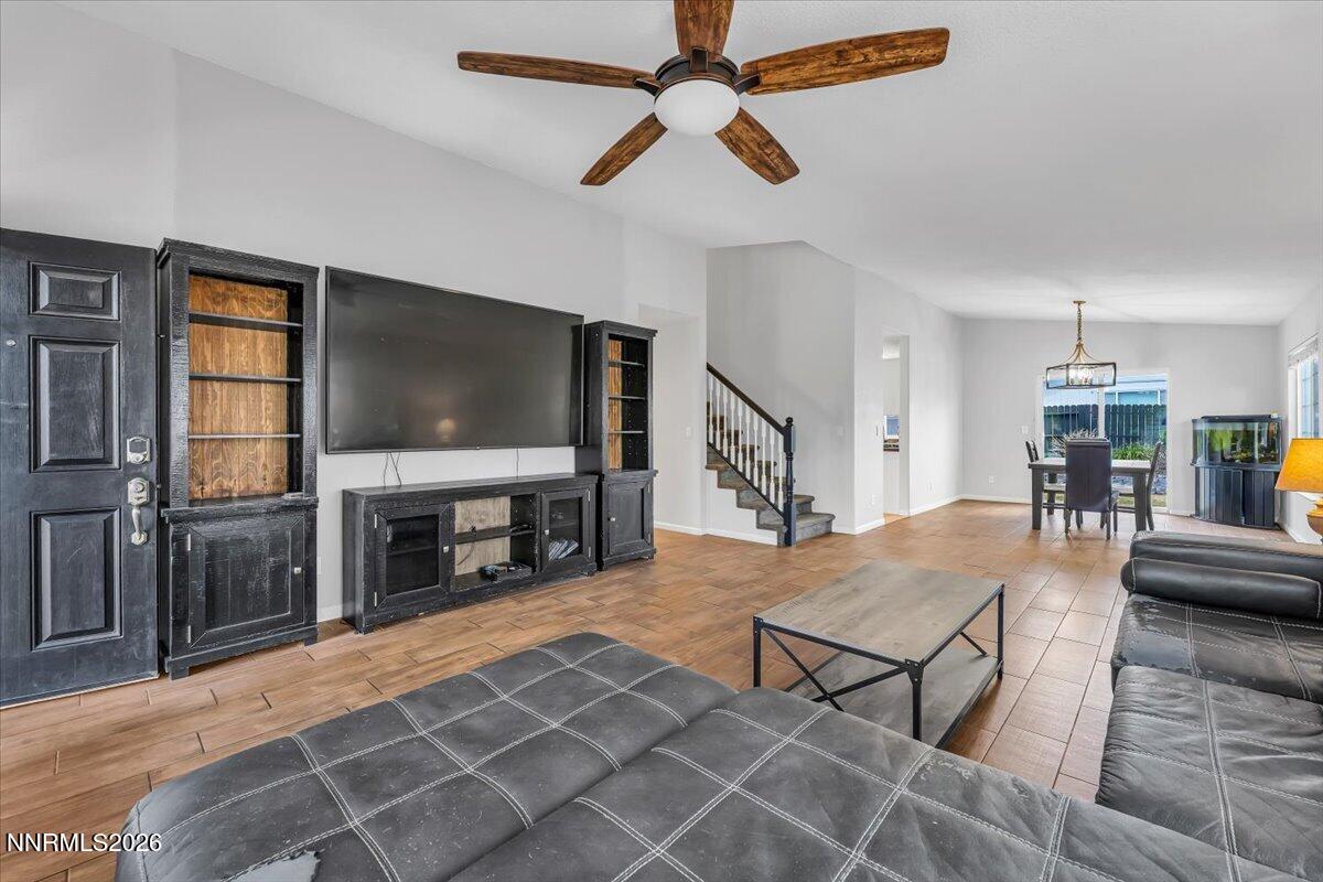 17725 Gingko Court Reno, NV 89508 - Photo 8 of 37 a living room with furniture and a flat screen tv