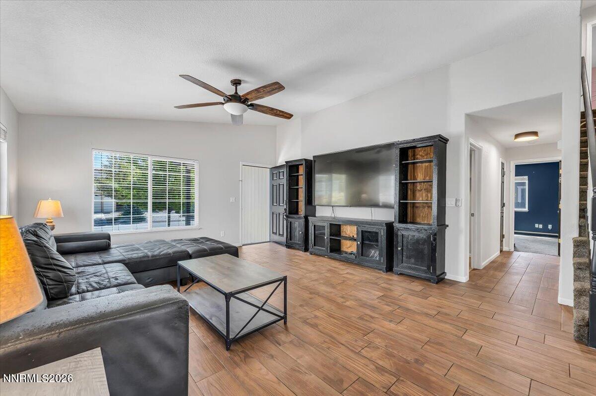17725 Gingko Court Reno, NV 89508 - Photo 9 of 37 a living room with furniture and a flat screen tv