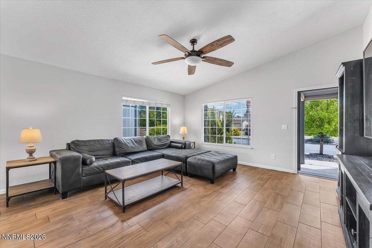 17725 Gingko Court Reno, NV 89508 - Photo 10 of 37 a living room with furniture and windows with wooden floor
