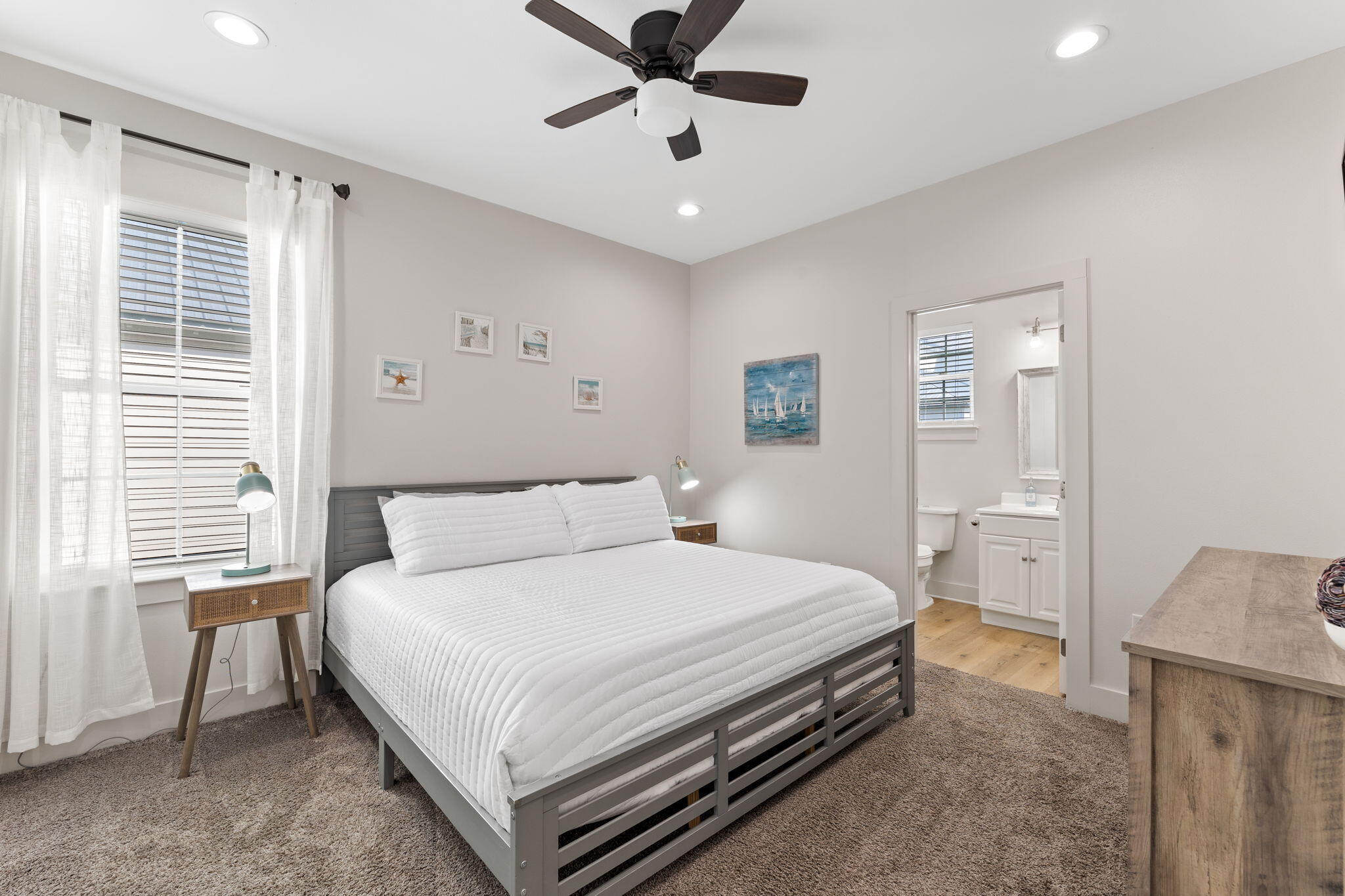 47 Ruth Street Miramar Beach, FL 32550 - Photo 44 of 63 a bedroom with a large bed and a chandelier