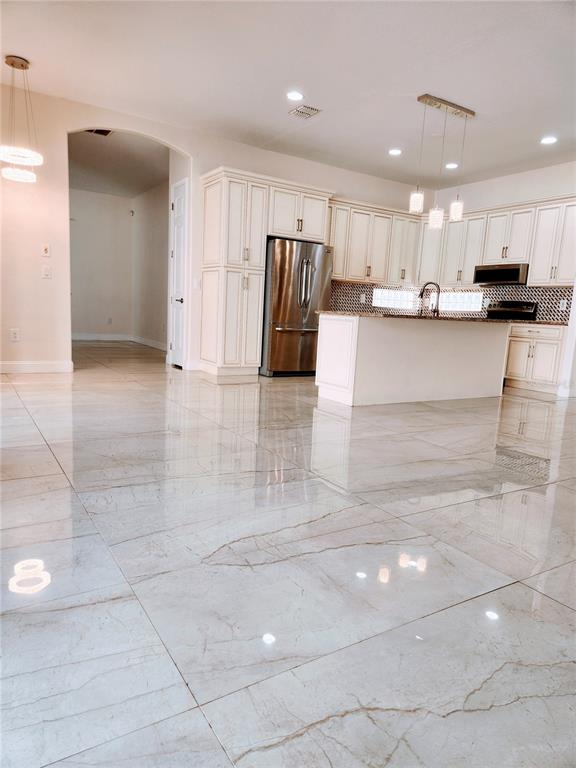 7190 Raymond Place Spring Hill, FL 34607 - Photo 11 of 41 a view of kitchen with refrigerator and cabinets