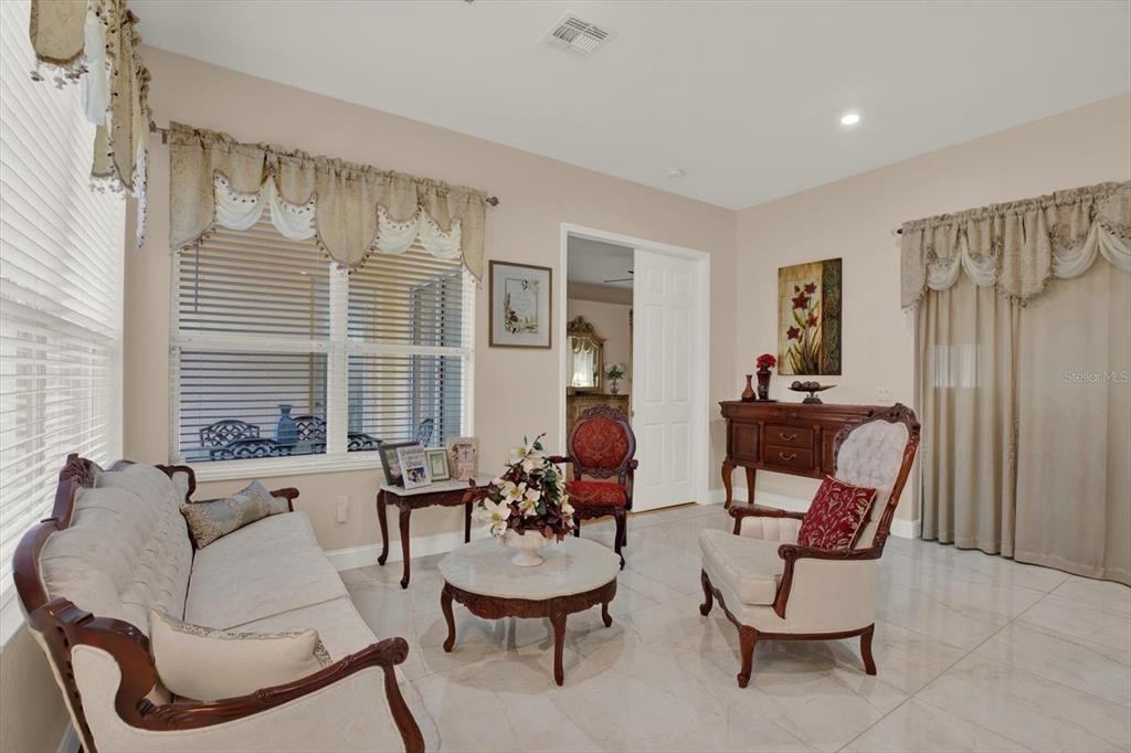 7190 Raymond Place Spring Hill, FL 34607 - Photo 14 of 41 a living room with furniture and a large window