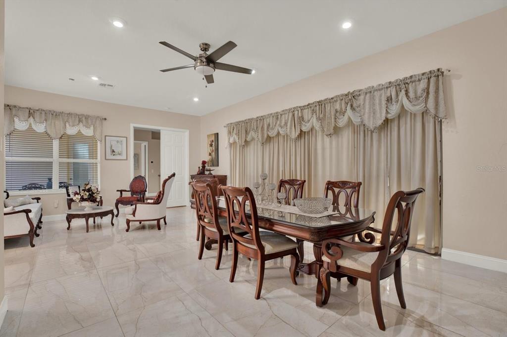 7190 Raymond Place Spring Hill, FL 34607 - Photo 17 of 41 a dining room with furniture and a potted plant