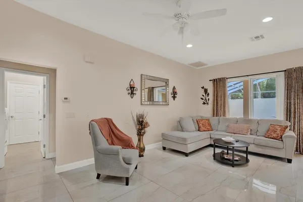 a living room with furniture and a window